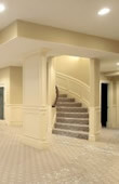 basement-remodel basement with winding stairs, recessed lights and carpet